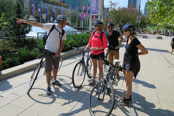 Stanley Park & Downtown - Vancouver Bike Tours - Vancouver Convention Centre: mountains, inner harbour, and Olympic-era details