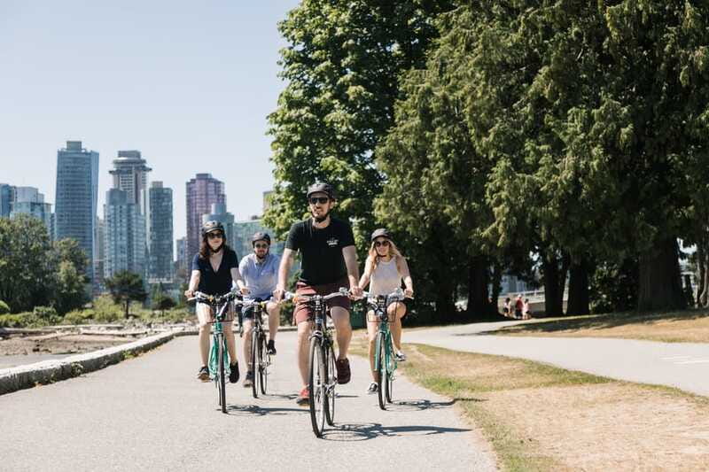 Vancouver: Stanley Park Bicycle Tour - Entering Stanley Park: forest trails, old-growth trees, and story stops